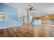 Spacious living room with hardwood floors and kitchen views at 11480 Moline St, Commerce City, CO 80640