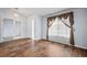 Living room with hardwood floors and a large window at 11480 Moline St, Commerce City, CO 80640
