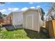 Tan colored storage shed in backyard at 11480 Moline St, Commerce City, CO 80640