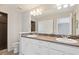 Bathroom with double vanity and walk-in shower at 19802 E 54Th Ave, Denver, CO 80249