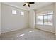 Spacious bedroom with lots of natural light from large windows at 19802 E 54Th Ave, Denver, CO 80249