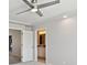 Cozy bedroom featuring a ceiling fan and an ensuite bathroom at 19802 E 54Th Ave, Denver, CO 80249