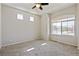 Bright bedroom with carpet flooring and large window at 19802 E 54Th Ave, Denver, CO 80249