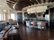 Elegant clubhouse featuring modern lighting, hardwood floors, and ample seating for social gatherings at 19802 E 54Th Ave, Denver, CO 80249