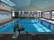 Bright indoor pool with chair lift, ample natural light, and easy access for a refreshing swim at 19802 E 54Th Ave, Denver, CO 80249