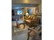 Basement with spiral staircase, leather couch, and wood chair at 4375 Tongue Rd, Indian Hills, CO 80454