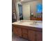 Double vanity bathroom with a view of a nearby room at 4375 Tongue Rd, Indian Hills, CO 80454