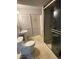 Clean bathroom with a shower, toilet and pedestal sink at 4375 Tongue Rd, Indian Hills, CO 80454