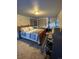Spacious Primary bedroom with a large bed and workspace at 4375 Tongue Rd, Indian Hills, CO 80454