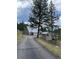 Long driveway leading to a-frame home and detached shed at 4375 Tongue Rd, Indian Hills, CO 80454