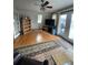 Spacious living room with hardwood floors, large windows, and access to deck at 4375 Tongue Rd, Indian Hills, CO 80454