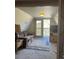 Living room with a couch, access to balcony and mountain views at 4375 Tongue Rd, Indian Hills, CO 80454