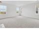 Spacious bedroom with neutral carpet and abundant natural light from multiple windows at 25303 E Warren Pl, Aurora, CO 80018