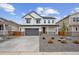 Charming two-story home features a well-maintained yard and a two-car garage at 25303 E Warren Pl, Aurora, CO 80018