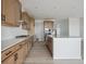 Modern kitchen with stylish wood cabinets, stainless steel appliances, and an island at 25303 E Warren Pl, Aurora, CO 80018