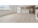 Bright open floor plan showcasing the kitchen and living area with scenic views at 25303 E Warren Pl, Aurora, CO 80018