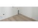 Clean utility room features vinyl flooring, white walls, and modern utility connections at 25303 E Warren Pl, Aurora, CO 80018