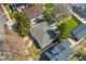 Aerial view of a well-landscaped home featuring mature trees and neighborhood surroundings on a sunny day at 4916 Knox Ct, Denver, CO 80221
