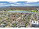 Captivating aerial view showcasing the property's location within a neighborhood, offering a glimpse of a nearby lake at 4916 Knox Ct, Denver, CO 80221