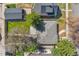 Aerial view of a well-maintained property with a gray roof, mature trees, and a private backyard at 4916 Knox Ct, Denver, CO 80221
