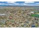 Scenic aerial view of the property's location within the neighborhood, with distant views of a lake and mountains at 4916 Knox Ct, Denver, CO 80221