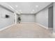 Spacious finished basement with plush carpeting, recessed lighting, and neutral paint palette at 4916 Knox Ct, Denver, CO 80221
