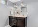 Bathroom with double vanity, stylish mirrors, modern lighting, and elegant decor at 4916 Knox Ct, Denver, CO 80221