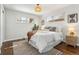 Cozy bedroom with large windows, wood floors, and contemporary furnishings at 4916 Knox Ct, Denver, CO 80221