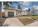 Charming single-story brick home with a well-maintained lawn, a walkway, and a one car garage at 4916 Knox Ct, Denver, CO 80221
