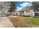Charming single-story brick home with a well-maintained lawn, a walkway, and a one car garage at 4916 Knox Ct, Denver, CO 80221