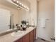 Bathroom features a double vanity and decorative accents on the counter at 5467 Zephyr Ct # 5467, Arvada, CO 80002