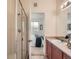 Bathroom boasts a glass shower and direct view into the bedroom at 5467 Zephyr Ct # 5467, Arvada, CO 80002