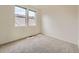 Bright bedroom with neutral carpet, large window, and natural light at 5467 Zephyr Ct # 5467, Arvada, CO 80002