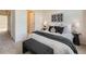 Bedroom with a large bed, side tables, and stylish decor accents at 5467 Zephyr Ct # 5467, Arvada, CO 80002