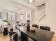 Open floor plan combines dining area with a view of the living room, fireplace and staircase at 5467 Zephyr Ct # 5467, Arvada, CO 80002