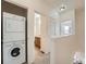 Hallway features a washer and dryer next to the bathroom at 5467 Zephyr Ct # 5467, Arvada, CO 80002