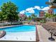 Beautiful community pool featuring lounge chairs and mature landscaping at 5467 Zephyr Ct # 5467, Arvada, CO 80002