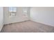 Bright bedroom with neutral carpet and bright natural light from the bright windows at 15286 Fillmore St, Thornton, CO 80602