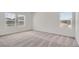 Cozy bedroom featuring neutral carpet and bright natural light at 15286 Fillmore St, Thornton, CO 80602