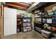 Organized basement storage with shelving units and a white storage cabinet at 6141 S Estes St, Littleton, CO 80123
