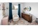 Charming bedroom with a soft rug, white walls, and unique decor accents at 6141 S Estes St, Littleton, CO 80123