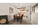 Bright dining room featuring a wooden table, black chairs, and sliding door to the backyard at 6141 S Estes St, Littleton, CO 80123
