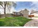Beautiful exterior of a well-maintained home featuring a lush green lawn at 6141 S Estes St, Littleton, CO 80123