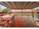 Beautiful covered patio featuring a spacious dining area and comfortable seating at 6141 S Estes St, Littleton, CO 80123