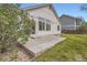 Home exterior showcasing a patio and well-maintained yard with a view of the neighboring houses at 15870 Duckweed Ct, Parker, CO 80134