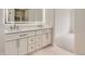 Bathroom featuring double vanity with bright lighting at 15870 Duckweed Ct, Parker, CO 80134