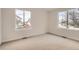 Well-lit bedroom featuring two large windows at 15870 Duckweed Ct, Parker, CO 80134