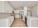 Bright kitchen with stainless steel appliances, granite countertops, island, and hardwood floors at 15870 Duckweed Ct, Parker, CO 80134