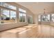 Spacious living room features hardwood floors, vaulted ceilings, and large windows, offering great views at 15870 Duckweed Ct, Parker, CO 80134