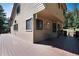 A house has a large back deck with room for seating to enjoy the outdoors at 8171 S Homesteader Dr, Morrison, CO 80465